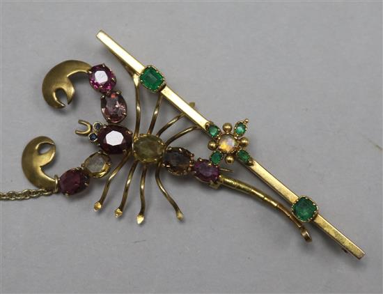 A gold, emerald and white opal set bar brooch and a gold and gem set scorpion brooch.